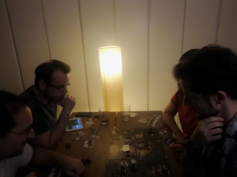 group of friends playing Mansions of Madness
