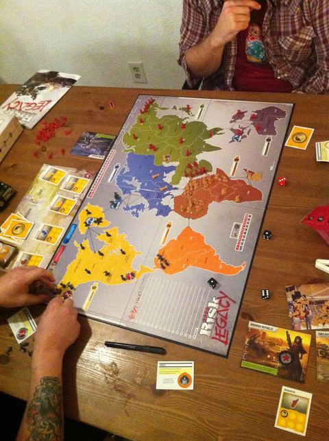Playing a version of the board game Risk.