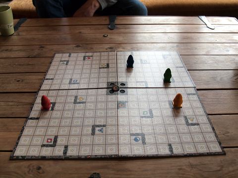 A game of Ricochet Robots being played at a special board game weekend camp in Finland.