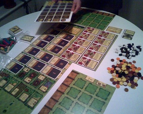 A game of Agricola is being set up.