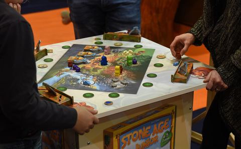 The game Stone Age Junior played at the board game fair Spiel '17 in Essen, Germany.