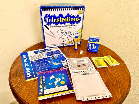 Telestrations party game of drawing and guessing